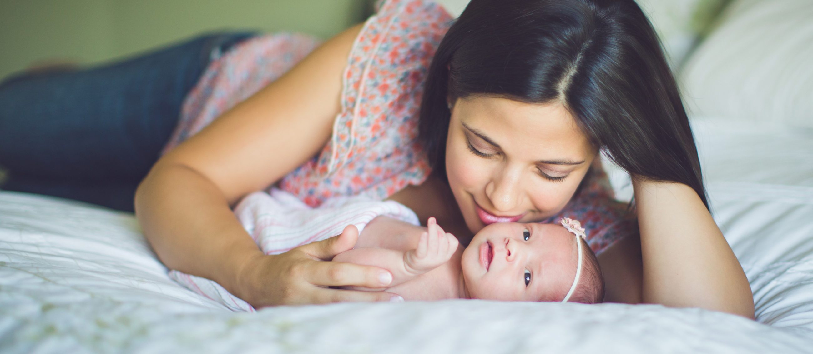 Emotionally well mother and infant cuddling 